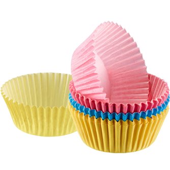 Blue pink yellow paper muffin cups and cupcakes